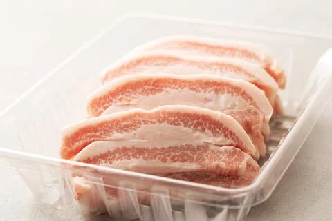 Fresh neck meat in packaging container Foto stock