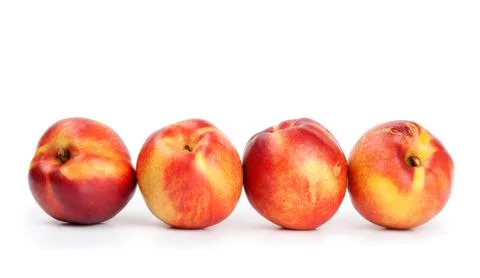 Fresh nectarines on a white background Stock Photos