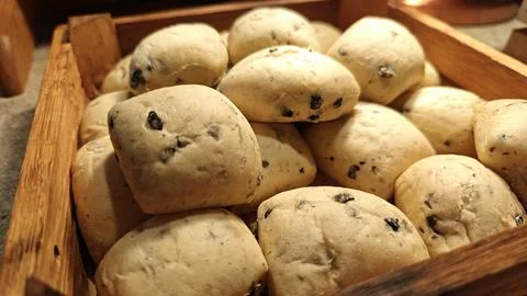 Fresh Olive Bread Rolls Displayed in Bakery Showcase Rustic Artisan Bread Stock Photos