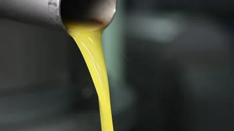 Fresh olive oil falling in recipient, extracted olive oil in industry Stock Footage 140218441