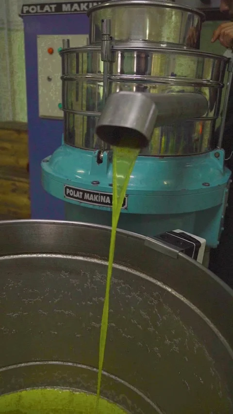 Fresh olive oil flow from separator - Izmir, Turkey, December 22, 2022 Stock Footage 327544668