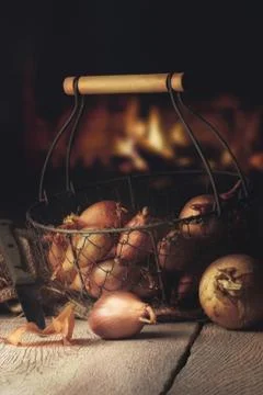 Fresh onion and shallot on a table in a warm kitchen Stock Photos