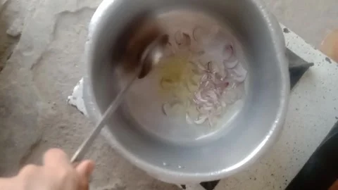 Fresh Onion Being Cut in a Pressure Cooker During Food Preparation Stock Footage 346877119