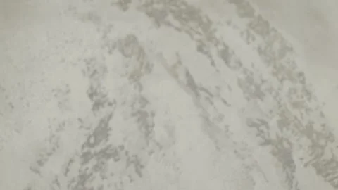 A Fresh Onion Placed on a Light and Clean Surface Ready for Cooking and Видео 284826177