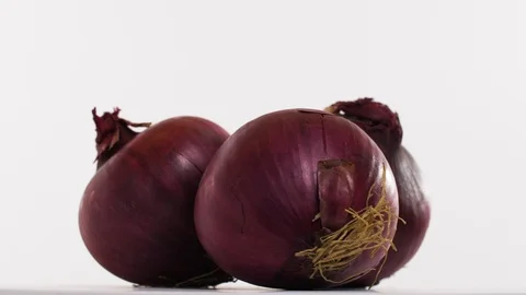Fresh onions on a rotating plate Stock Footage 123205479