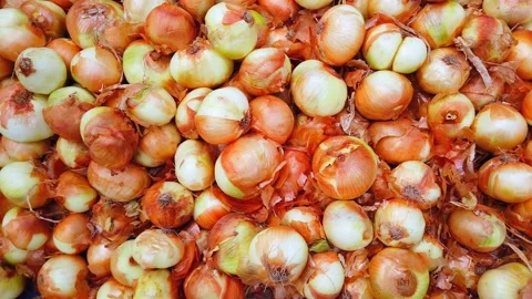 Fresh onions on store or bazaar counter. Close-up. Stock Footage 135265903