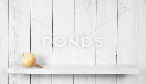 Fresh Onions On Wooden Shelf