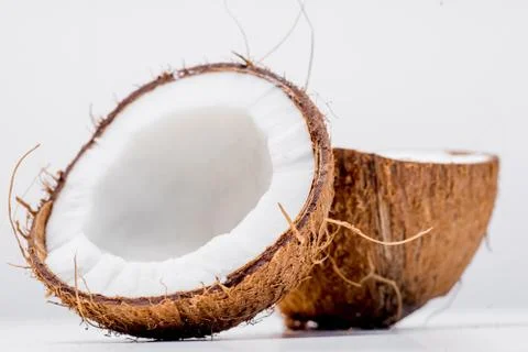 Fresh open coconut on a white background Stock Photos