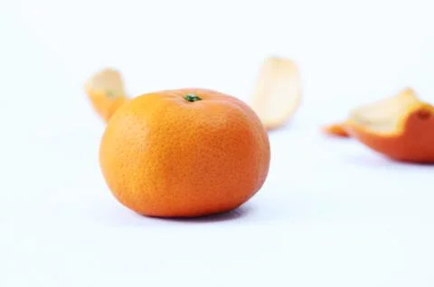Fresh orange and orange peeles skin as background Stock Photos