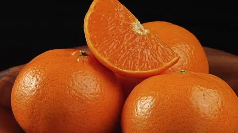 Fresh orange on black background. 库存影片 344093374