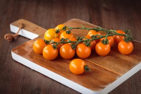 Fresh orange cherry tomatoes Stock Photos