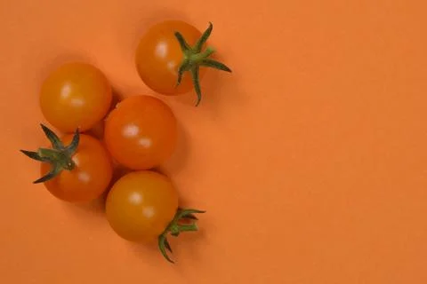 Fresh orange cherry tomatoes Stock Photos