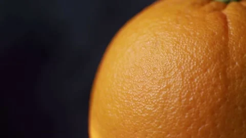 A fresh orange close up in slow motion Stockbeeldmateriaal 148332554