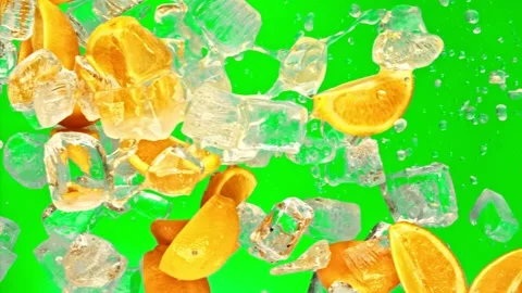Fresh orange fruit, ice cube and drops juicy or alcohol beverage or energy drink Stock Footage 226523769