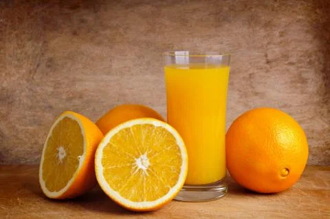 Fresh orange juice and oranges Stock Photos