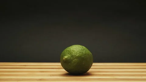 Fresh orange lime lemon apple kiwi is spining. Stop Motion Animation Stock Footage 87837057