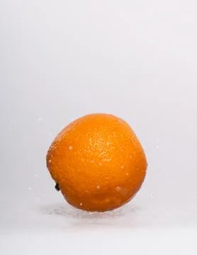Fresh orange lying on a gray background Stock Photos