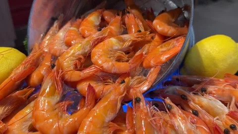 Fresh orange shrimps with shells displayed on ice Stock Footage 316812982