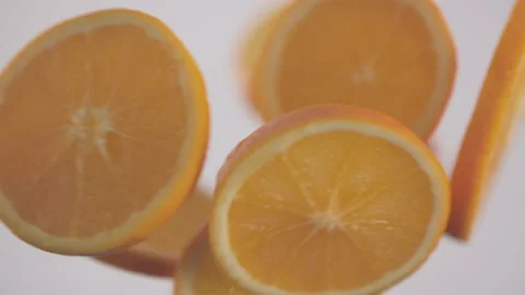 Fresh orange slices in circle shape collide each in slow motion Stock Footage 147231607