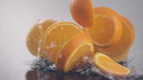 Fresh orange slices in circle shape fall down in slow motion Stock Footage 147231702