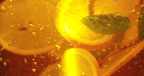 Fresh orange slices float in water with mint in slow motion. Juicy orange 動画素材 152951680