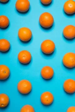 Fresh oranges on the blue background Stock Photos