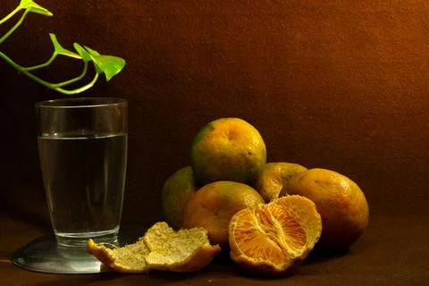 Fresh oranges on a brown background Stock Photos