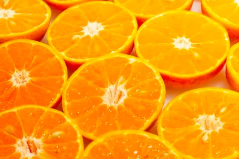 Fresh oranges cut in half Stock Photos