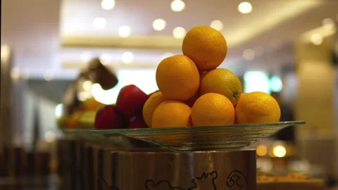 Fresh Oranges Displayed in Decorative Bowl at Luxury Hotel Buffet Stock Footage 341654916