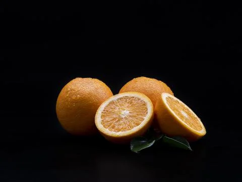Fresh oranges fruit on the black background. Foto stock