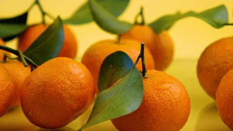 Fresh oranges with leaves background Video stock 122187445