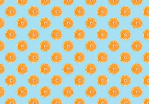 Fresh oranges  pattern on blue background. Minimal concept. Summer minimal co Stock Photos