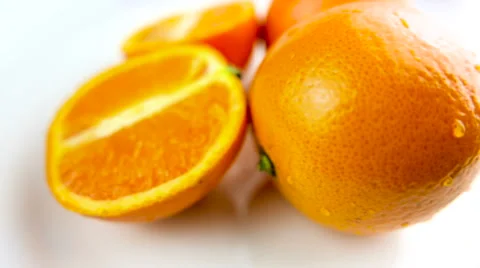 Fresh Oranges Rotating on White Background Stock Footage 62466795
