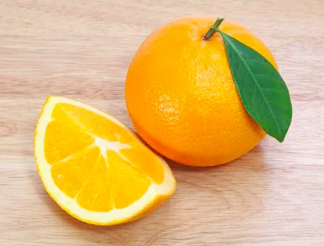 Fresh oranges on a table. Stock Photos