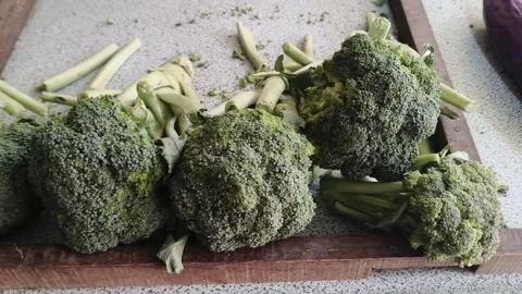 Fresh organic broccoli heads on display table Stock Footage 346659603