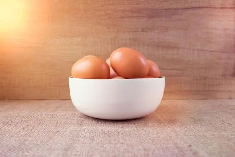 Fresh organic chicken rooster eggs in white bowl from local farmer market. Stock Photos