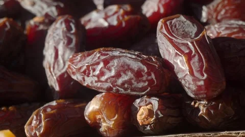 Fresh organic dates heap rotating close up in sunlight for healthy food con.. Stock Footage 332139664