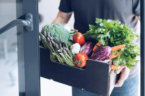 Fresh organic greens and vegetables delivery Stock Photos