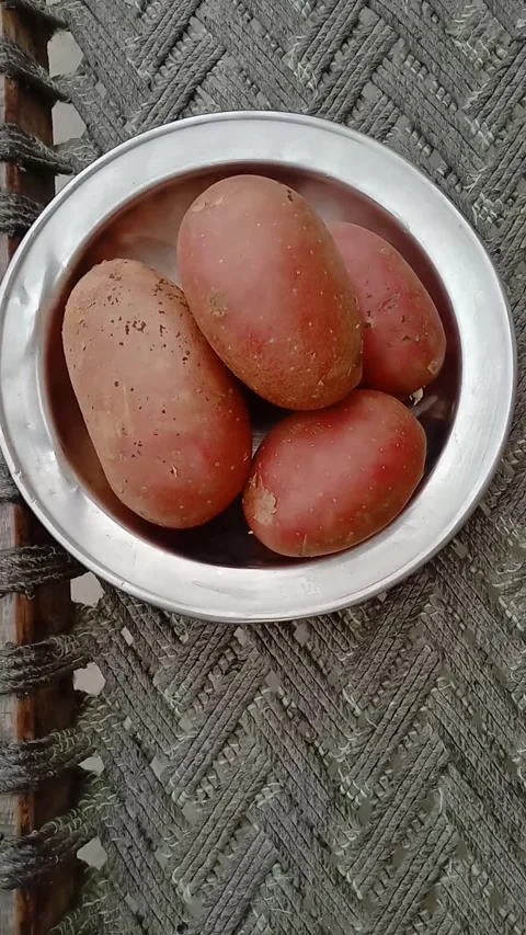Fresh Organic Potatoes Placed on a Clean Plate Stock Footage 331899841