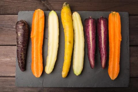 Fresh organic rainbow carrots on a wooden table Stock Photos