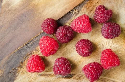 Fresh Organic Raspberry on Rustic Background. Stock Photos