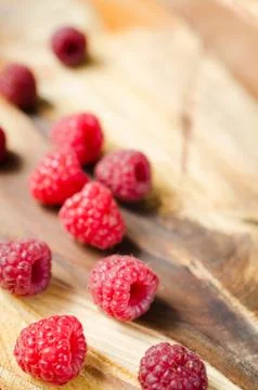 Fresh Organic Raspberry on Rustic Background. Stock Photos