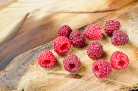 Fresh Organic Raspberry on Rustic Background. Stock Photos