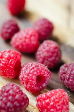 Fresh Organic Raspberry on Rustic Background. Stock Photos