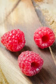 Fresh Organic Raspberry on Rustic Background. Stock Photos