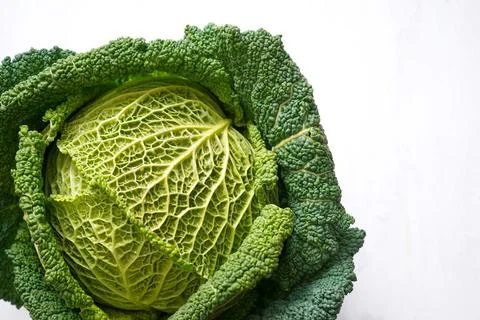 Fresh organic savoy cabbage head isolated on a white background Stock Photos