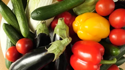 Fresh organic vegetables assortment rotating on a plate Stock Footage 342436779