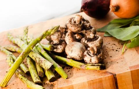 Fresh organic vegetables on cutting board Stock Photos