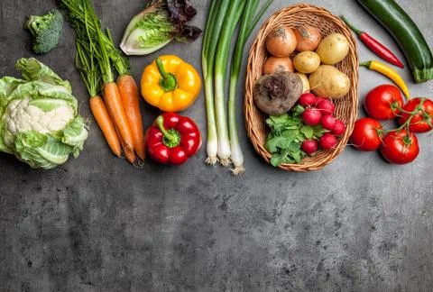 Fresh organic vegetables on rustic background Stock Photos