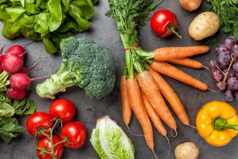 Fresh organic vegetables on rustic background Stock Photos